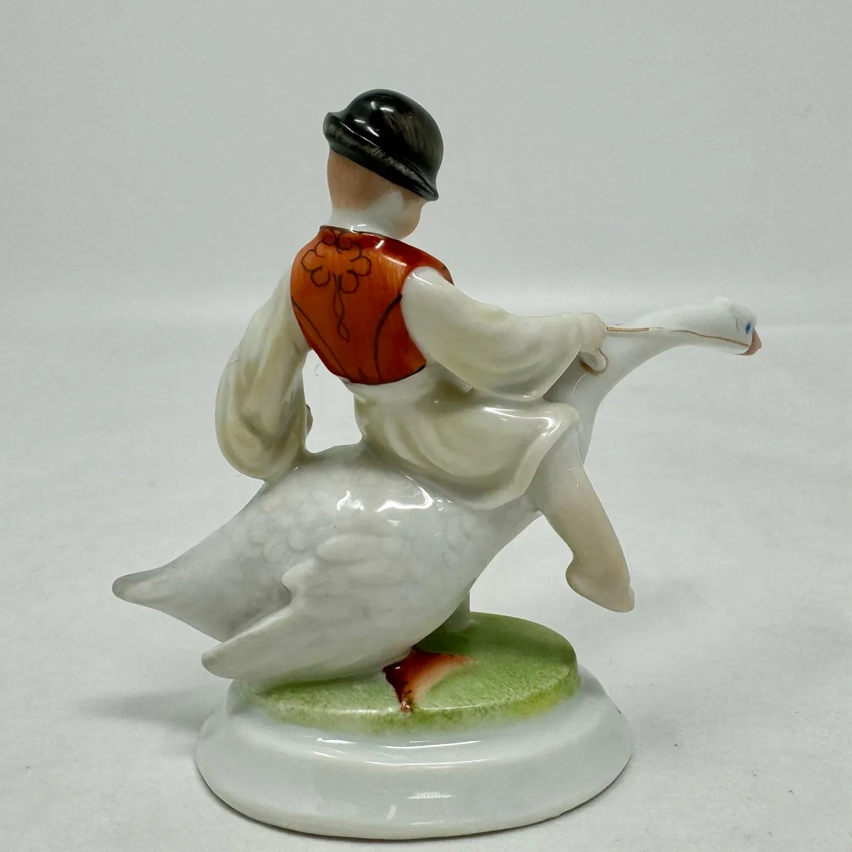 Boy Riding Goose Porcelain Figurine