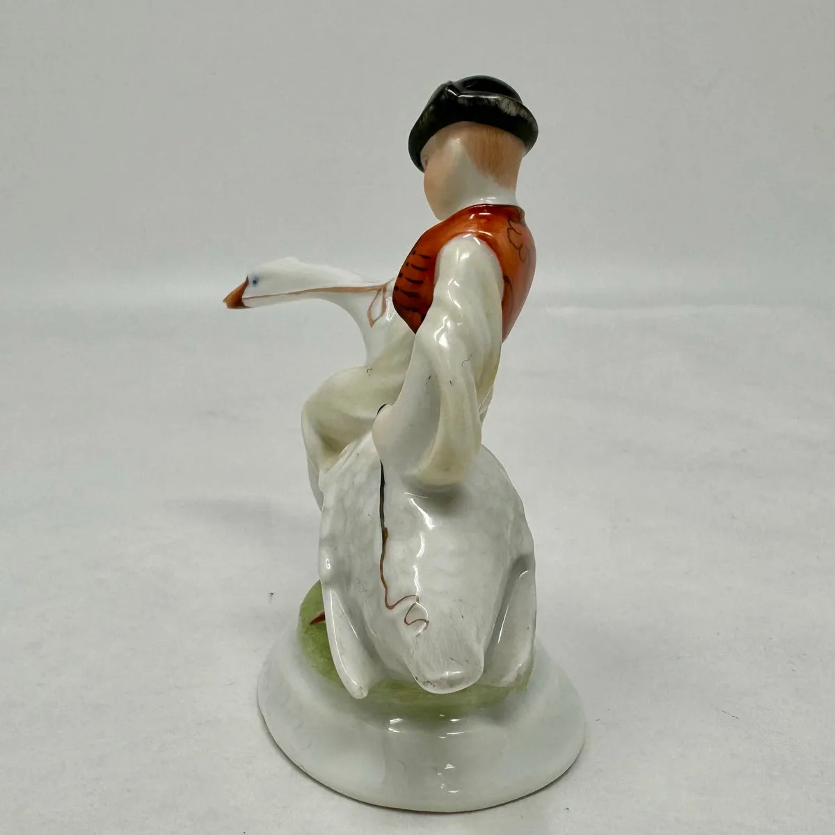 Boy Riding Goose Porcelain Figurine