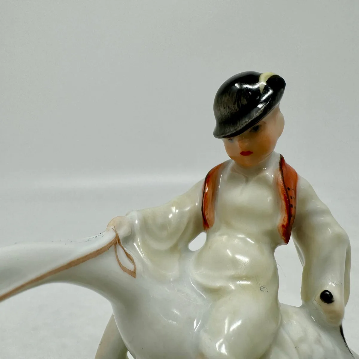 Boy Riding Goose Porcelain Figurine